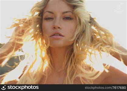 Beautiful slender blonde at the sea. Summer travel photos. Pretty lady