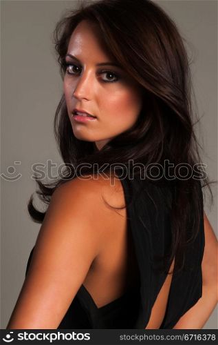 Beautiful slender brunette in a black blouse