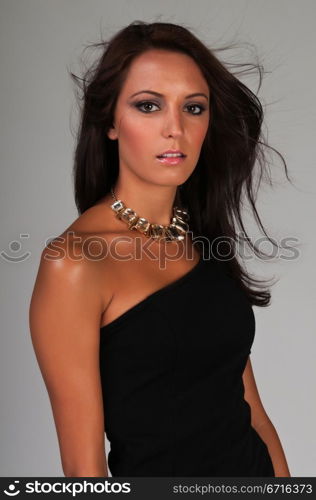 Beautiful slender brunette in a little black dress