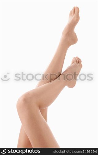 Beautiful slender legs on a white background