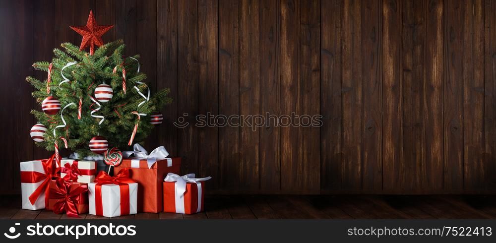 Beautiful small decorated Christmas Tree and many gifts. Christmas Tree and gifts