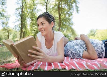 beautiful smiling couple enjoying a good book