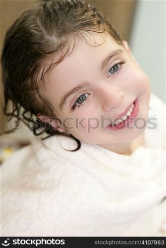 beautiful smiling girl with white towel in bathroom