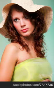 Beautiful smiling spring or summer woman in hat. Green concept