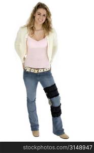 Beautiful smiling teen with leg brace. Full body over white with clipping path.