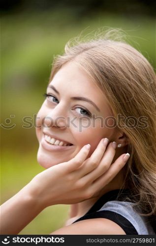 Beautiful smiling woman . Beautiful young woman smiling, outdoor portrait