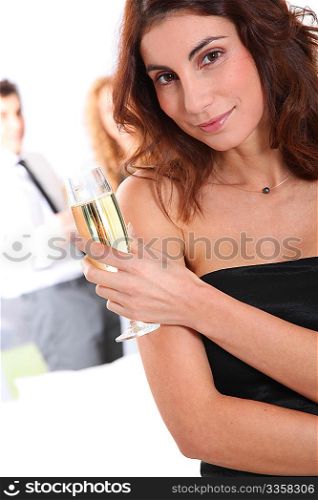 Beautiful smiling woman holding glass of champagne
