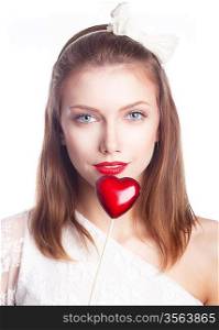 Beautiful smiling woman holding red heart shape symbol - valentines day concept