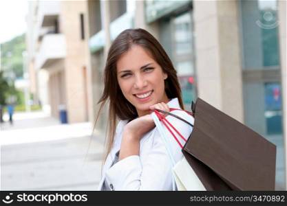 Beautiful smiling woman holding shopping bags