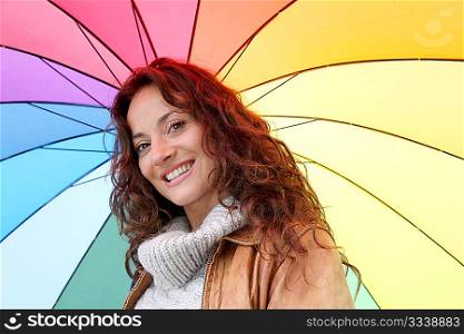 Beautiful smiling woman on a raining day