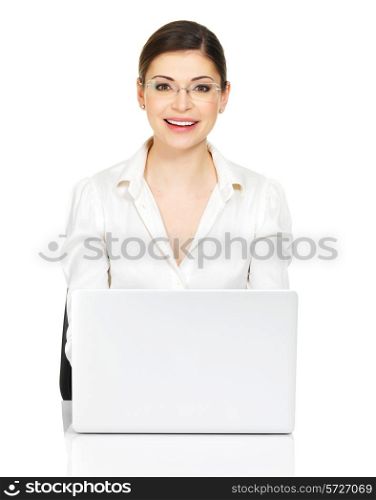Beautiful smiling woman sits from th? table with laptop in white shirt - isolated on white. &#xA;