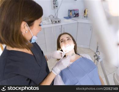 beautiful smiling young woman having dental check up