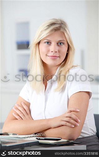 Beautiful smiling young woman working in the office