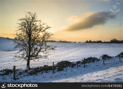 Beautiful snow covered Winter landscape at sunrise in Peak Distr. Landscapes. Snow covered Winter landscape at sunrise in Peak District in England