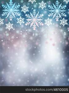 Beautiful snowflakes border on blurry background, cute Christmas greeting card with copy space, festive wintertime decoration