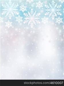 Beautiful snowflakes border on blurry background, cute Christmas greeting card with copy space, festive winter time decoration