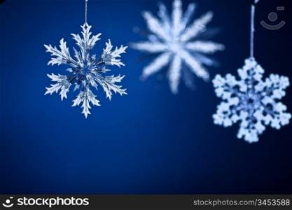 Beautiful snowflakes on blue gradient background. Christmas concept
