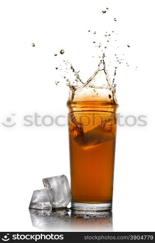 Beautiful splash of cola in glass and ice cubes isolated on white