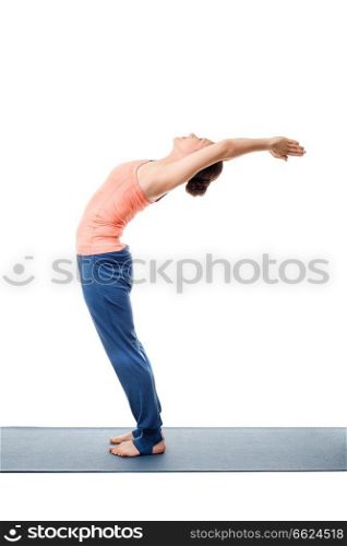 Beautiful sporty fit woman practices Sivananmda yoga asana Anuvittasana  - standing back bend pose isolated on white. Sporty fit woman practices yoga asana Anuvittasana
