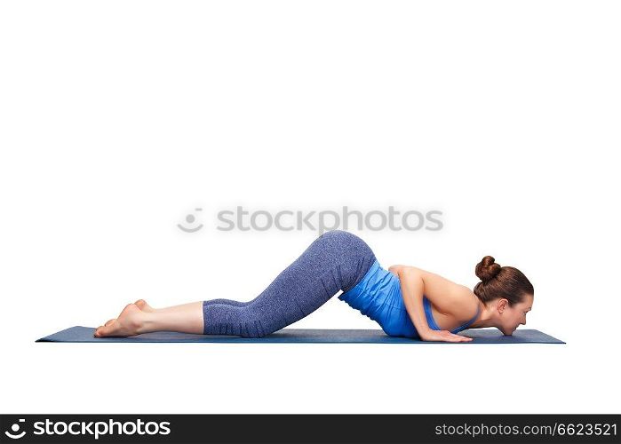 Beautiful sporty fit yogini woman practices yoga asana Ashtangasana - eight-limbed pose in studio isolated on white. Sporty fit yogini woman practices yoga asana Ashtangasana