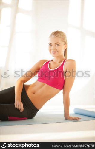 beautiful sporty woman doing exercise on the floor