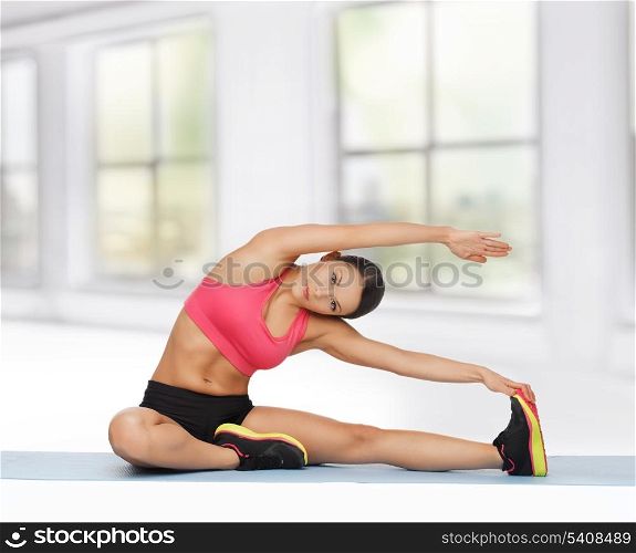 beautiful sporty woman doing exercise on the floor