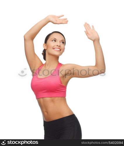 beautiful sporty woman in aerobic or dance movement
