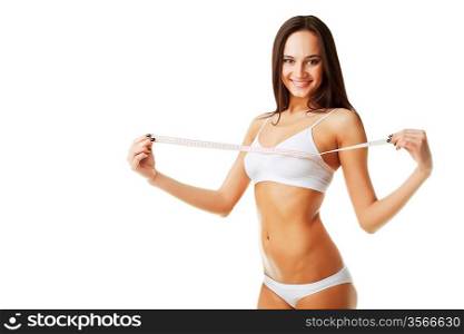 Beautiful sporty woman with white measure on chest on white background