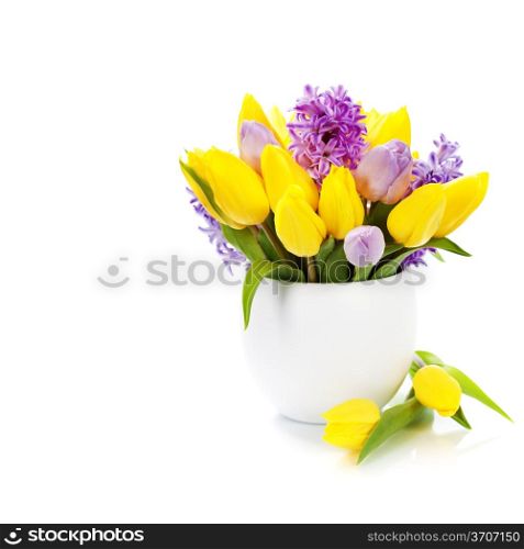 Beautiful spring flowers in vase over white