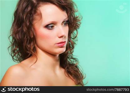 Beautiful spring or summer woman curly hair. Green concept