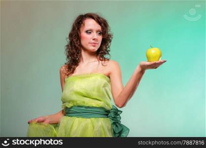 Beautiful spring woman with apple. Green or dieting concept. Healthy eating