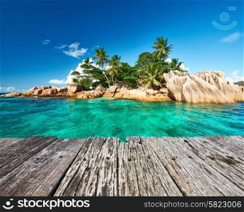 Beautiful St. Pierre Island and old wooden pier at Seychelles