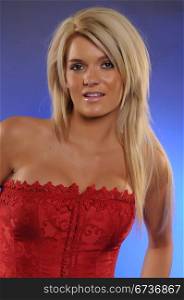 Beautiful statuesque blonde in a red bustier