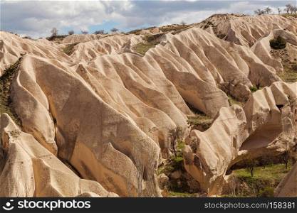 Beautiful stone cliffs in valley named Rose valley near Meskendir, Goreme, Turkey. Rose valley near Goreme, Turkey
