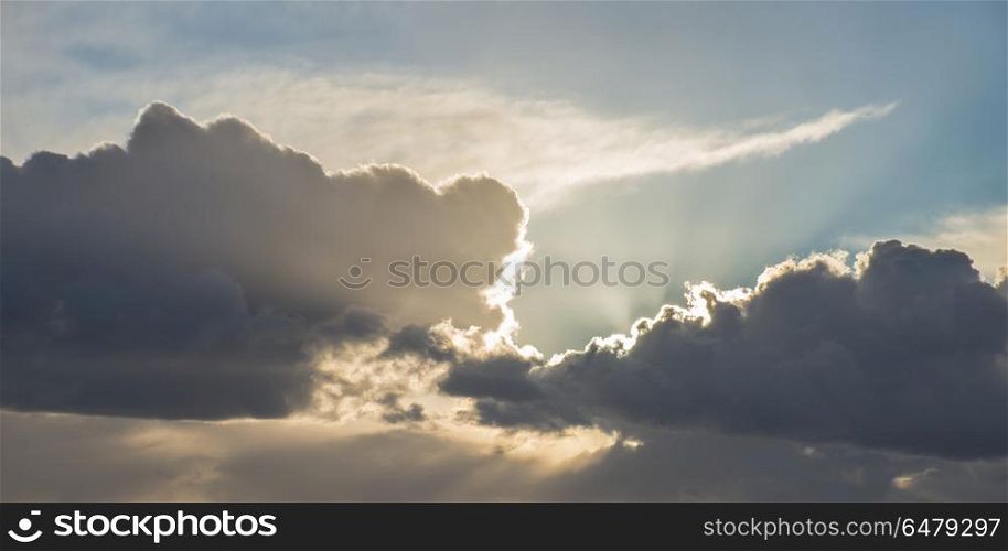 Beautiful stormy moody cloudy sky over English countryside lands. Beautiful stormy dramatic cloud formations over English countryside landscape
