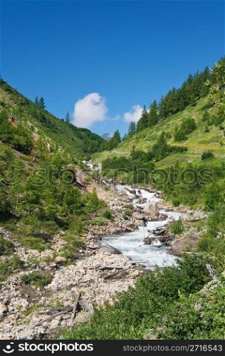 beautiful stream between rocks in Veny valley, Courmayeur. Italy