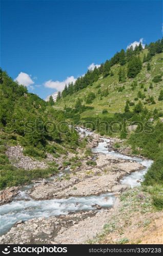 beautiful stream between rocks in Veny valley, Italy