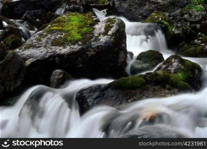 Beautiful stream with huge rocks in mountain