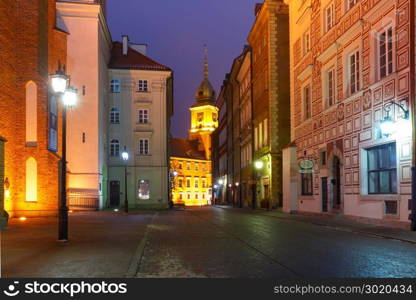 Beautiful street in Old Town of Warsaw, Poland. Royal Castle and beautiful street in Old Town during evening blue hour, Warsaw, Poland.