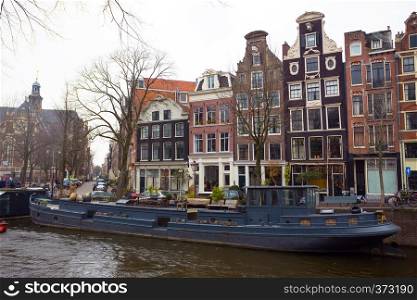 beautiful streets, canal and house on the water in the famous city of amsterdam, netherlands