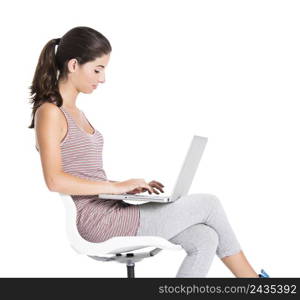 Beautiful student sitting in a chair with a laptop, isolated over a white background