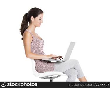Beautiful student sitting in a chair with a laptop, isolated over a white background