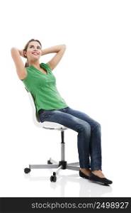 Beautiful student sitting on a chair, isolated over a white background
