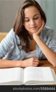 Beautiful student teenage girl enjoy reading book at home