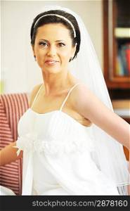 beautiful stylish bride in white dress in room