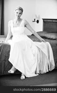 beautiful stylish bride in white dress in room