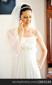 beautiful stylish bride speaks on phone