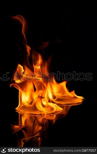 Beautiful stylish fire flames reflected in water