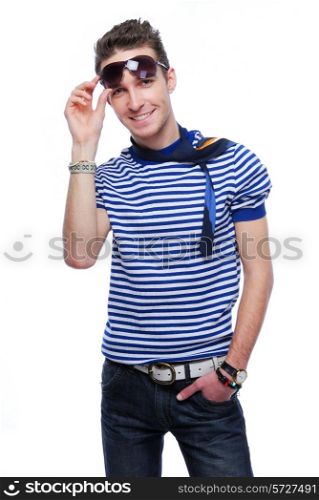 beautiful stylish young guy lift up sunglasses and smiling - on white background