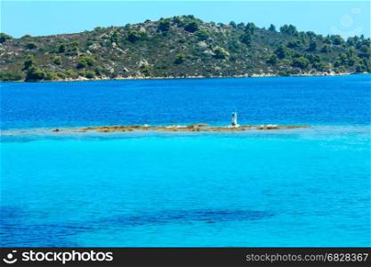 Beautiful summer Aegean Sea coast and beacon (near Lagonisi , Sithonia, Halkidiki, Greece).